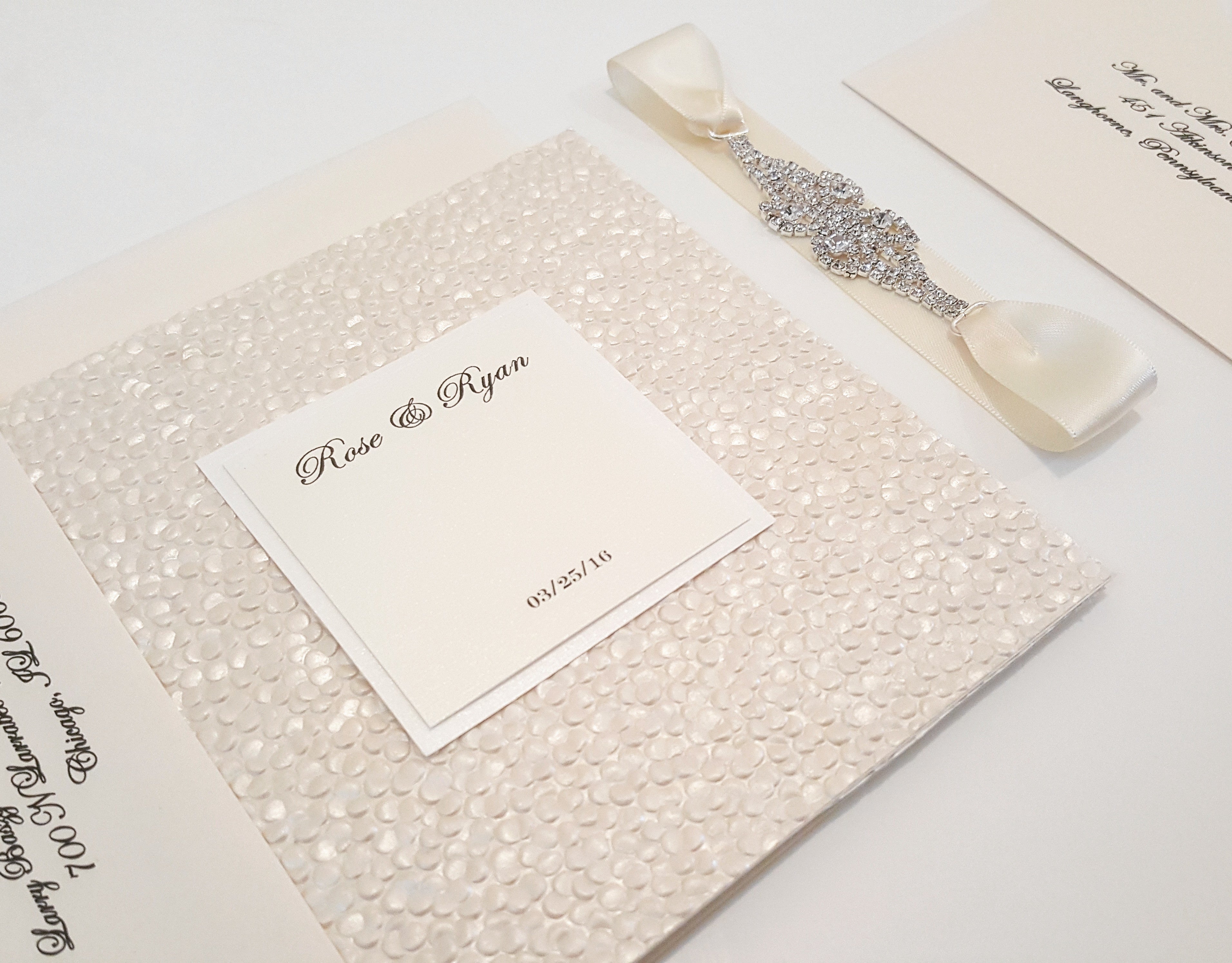 Pebbles Wedding Invitation with a Rhinestone Jewel